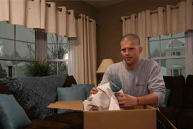 Man Unpacking Boxes