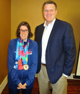 Amanda Church shows off her Special Olympics World Games medals with Olympia Moving & Storage Founder & President Michael Gilmartin
